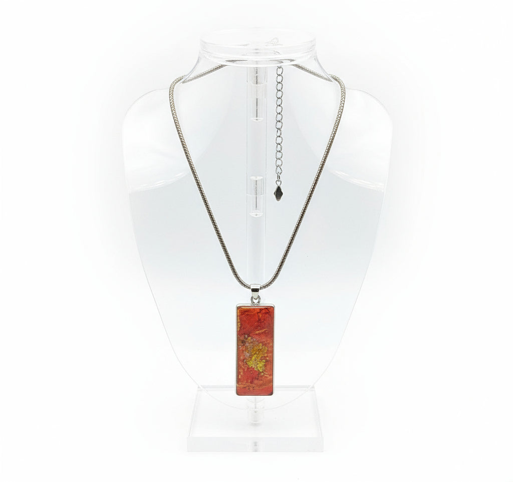 Autumn Botanical Rectangle Resin Necklace on display stand with silver chain